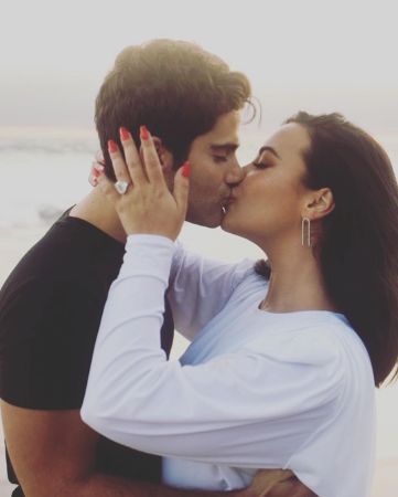 Max Ehrich and ex-fiance Demi Lovato kissing. 
